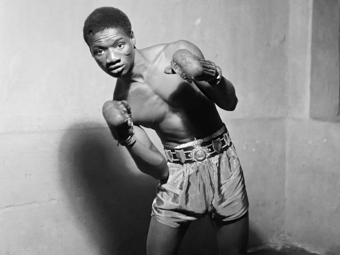 James Barnor (Ghana, b. 1929). Ginger Nyarku wearing the Coronation Belt, Accra, 1953 (printed 2010–20). Gelatin silver print. Autograph, London.