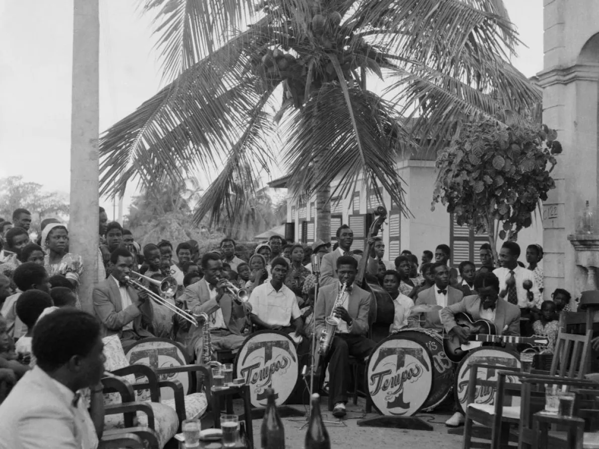 James Barnor (Ghana, b. 1929). Tempos Band, birthday celebrations, Adabraka neighborhood, Accra, 1958 (printed 2010–20). Gelatin silver print. Galerie Clémentine de la Féronnière, Paris. © James Barnor, courtesy Galerie Clémentine de la Féronnière, Paris.